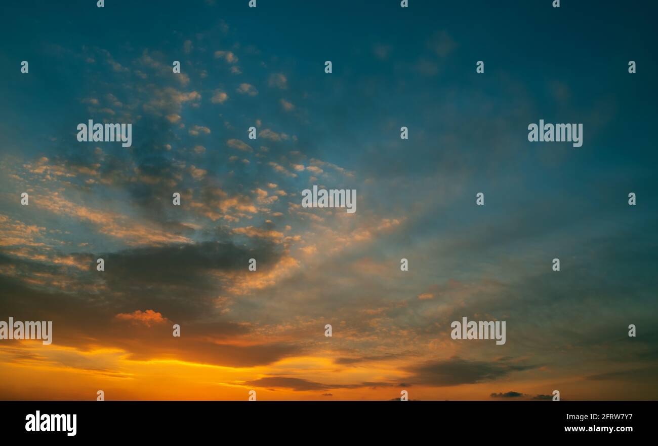Beautiful colorful sunset sky with clouds and sunlight Stock Photo - Alamy