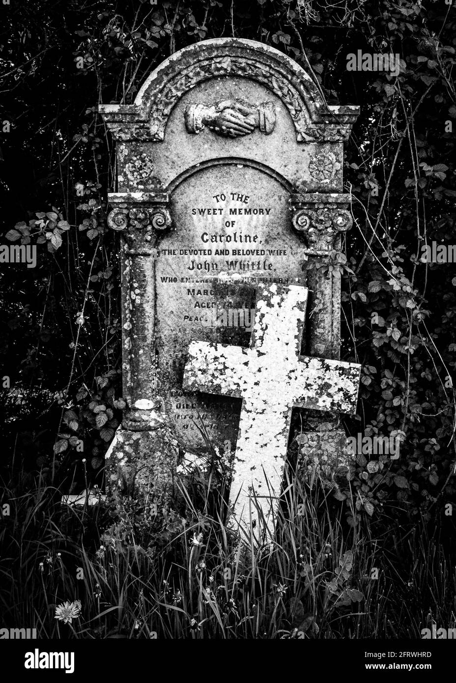 The grave of Caroline Whittle in the little village churchyard at Cucklington, Somerset, UK. (Black & white version) Stock Photo