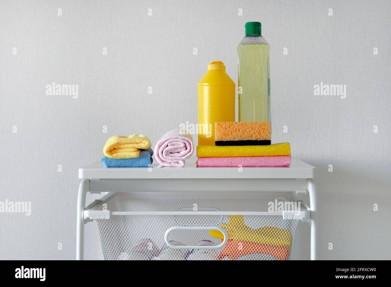 Detergent for cleaning room. Dry cleaning concept. Plastic bottles with cleaning agent and tools
