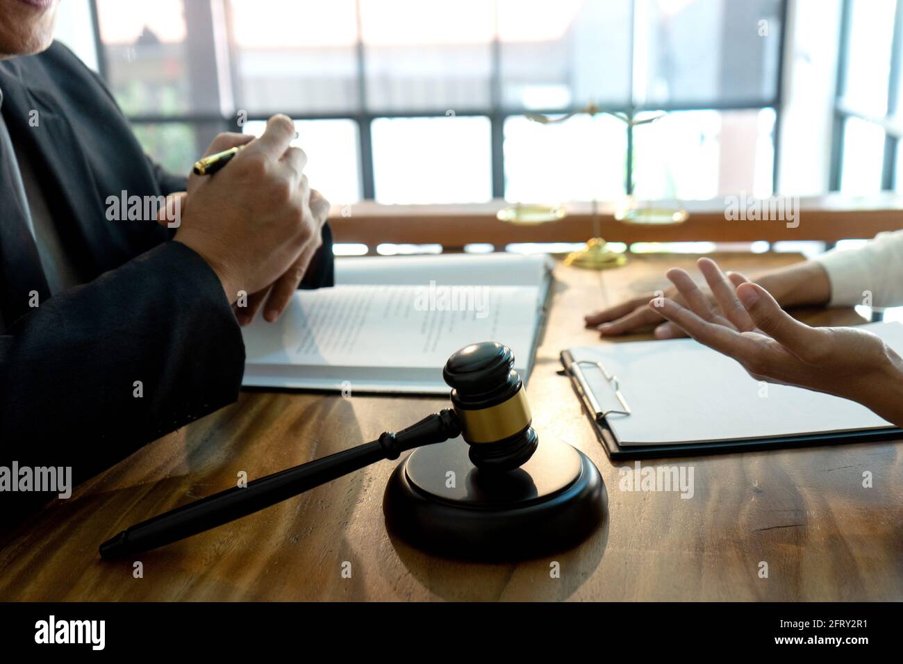 Judge or lawyer talking  with team or client about consult law detail, law firm concept. Stock Photo