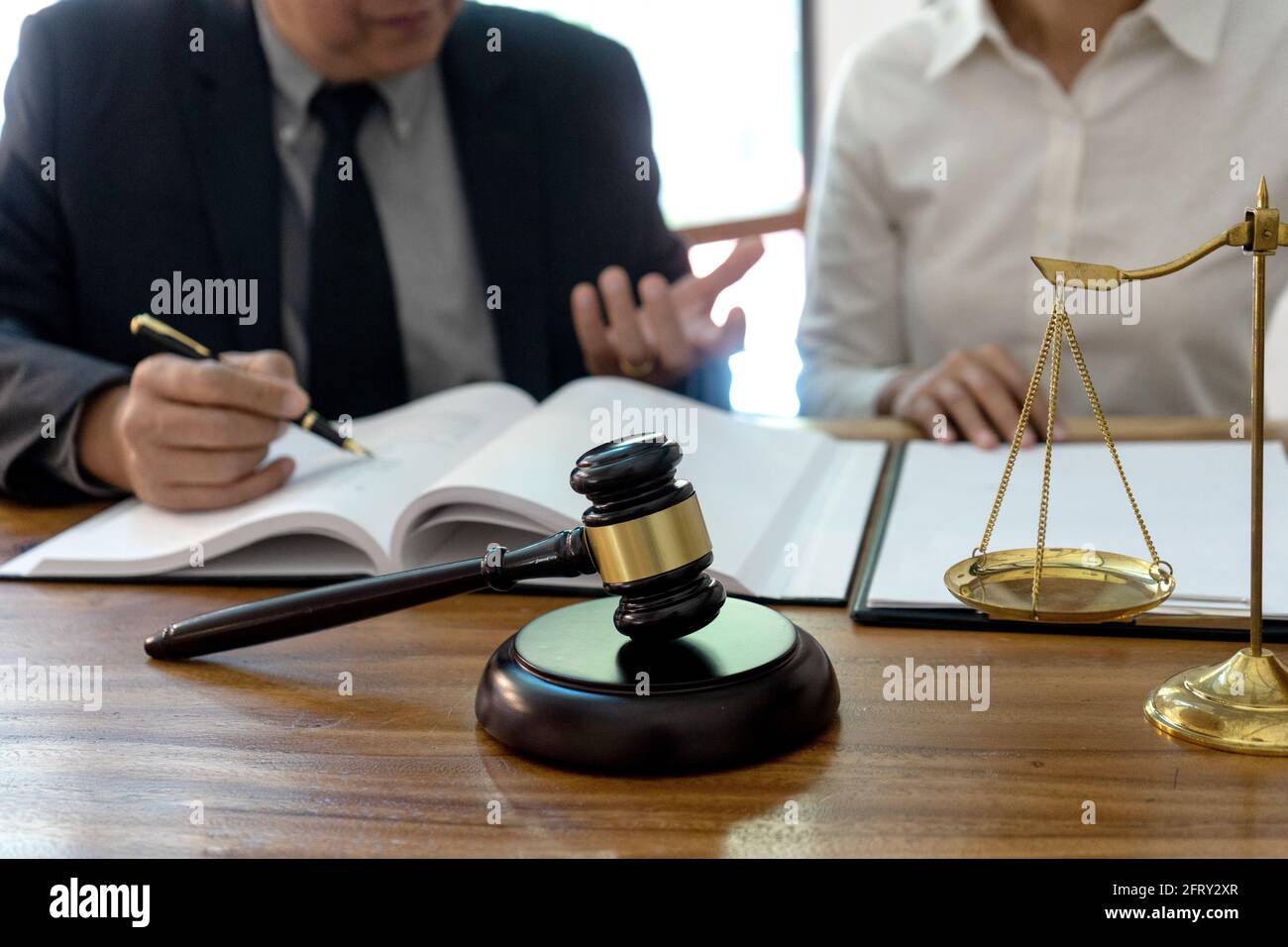 Judge or lawyer talking  with team or client about consult law detail, law firm concept. Stock Photo