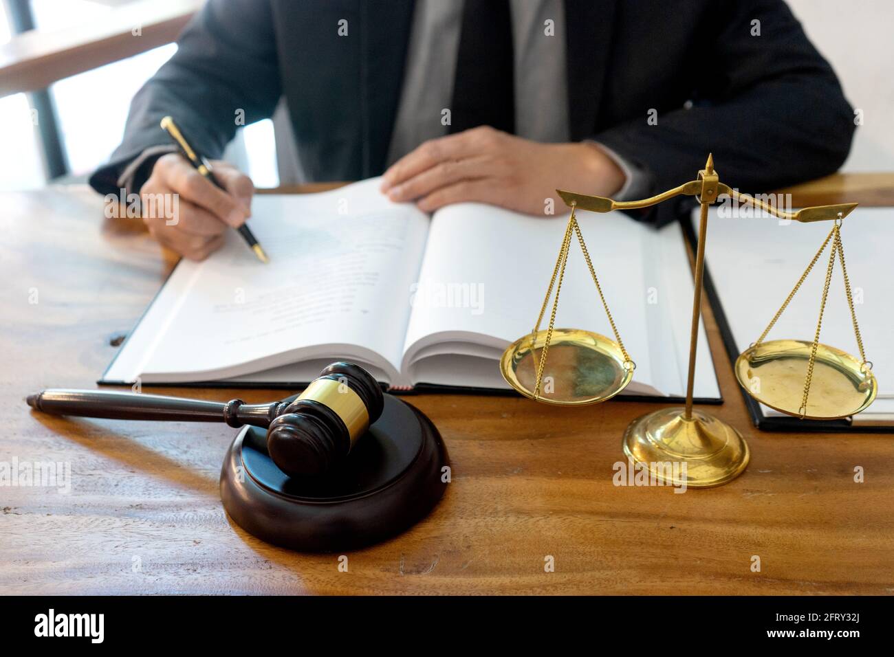 Judge or lawyer have gavel with  balance work in office  in law firm concept. Stock Photo
