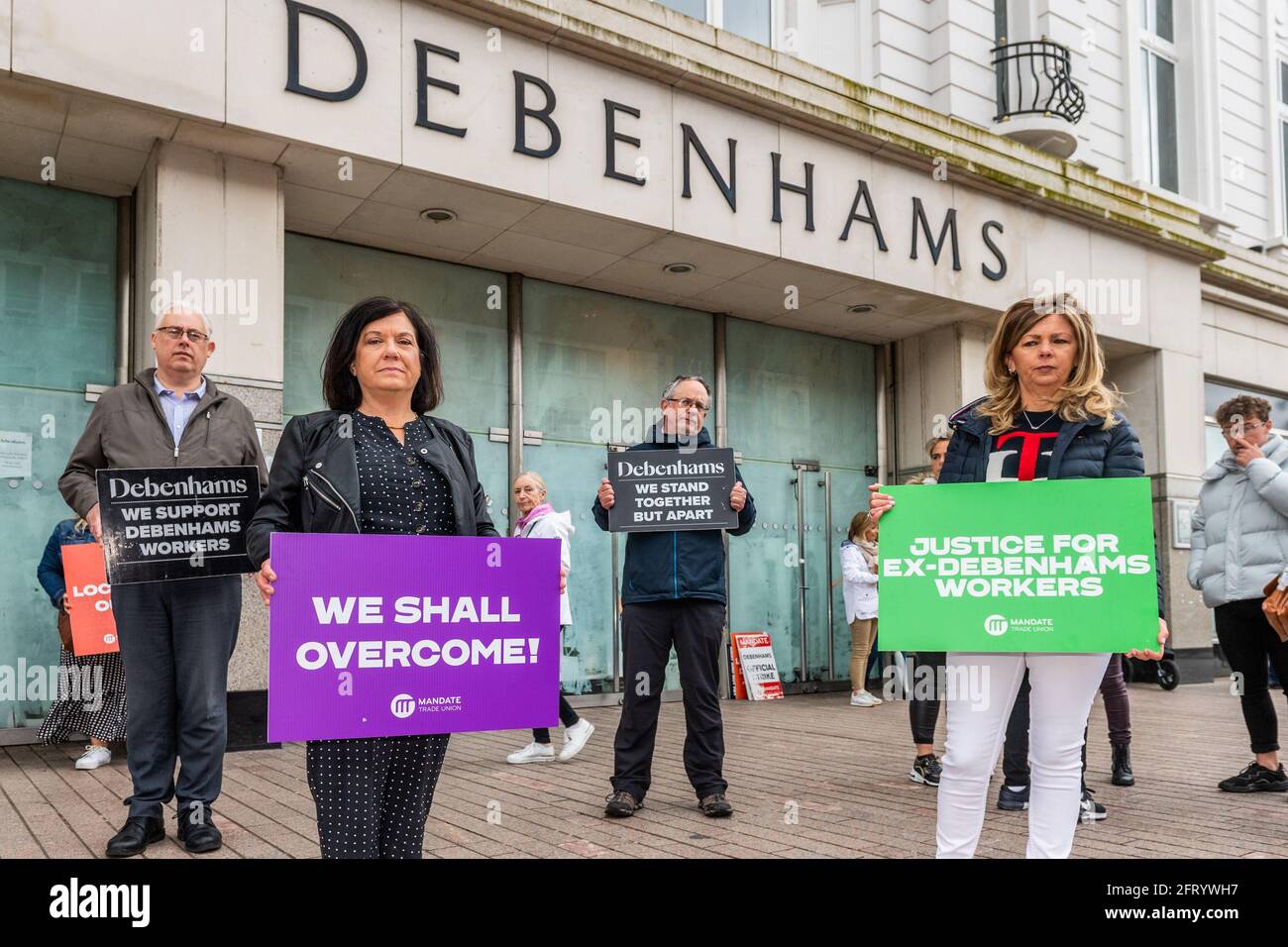 Cork, Ireland. 21st May, 2021. After 406 days outside Debenhams Patrick Street, Cork store, ex-workers have called off their protest. The ex-Debenhams staff were protesting to receive their full redundancy entitlement, but were offered a €3m 'upskilling' package, which they accepted with a majority vote yesterday. Pictured are Thomas Gould TD (SF); Valerie Conlon, ex-Debenhams shop steward; Mick Barry TD (Irish Solidarity-People Before Profit) and protester Madeline Whelan. Credit: AG News/Alamy Live News Stock Photo
