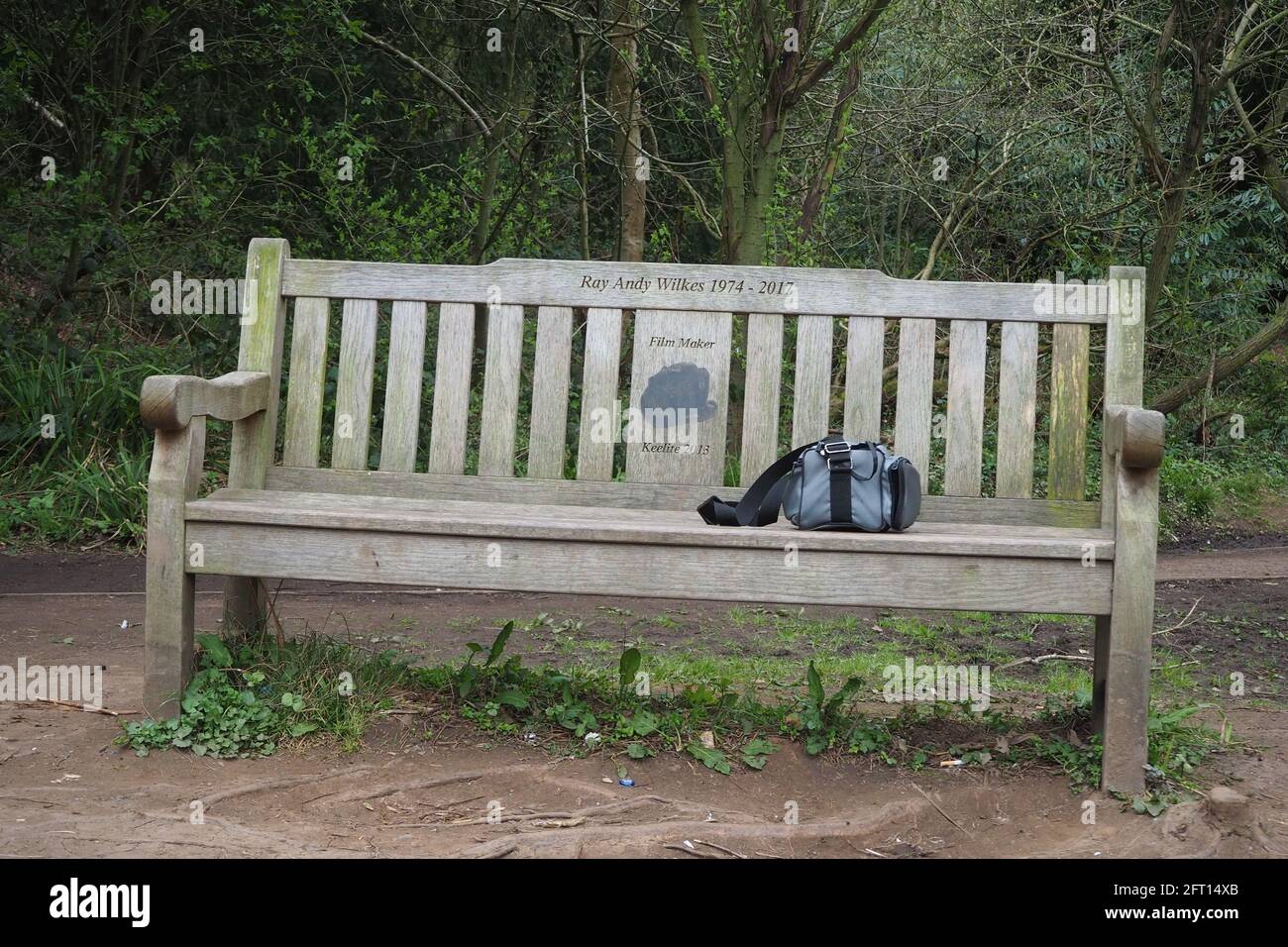 Memorial Bench with the Photographers bag on it Stock Photo