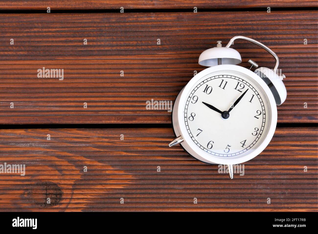 vintage alarm clock on wood background Stock Photo - Alamy