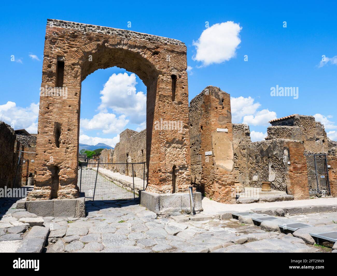 Honorary arch of Caligula - Pompeii archaeological site, Italy Stock Photo
