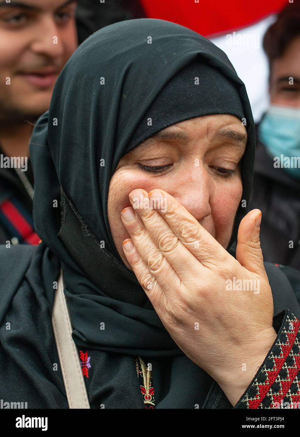 London, UK. 15th May 2021. Crying Palestinian woman protester at the Save Sheikh Jarrah rally for a Free Palestine, urging the UK government to take immediate action and stop allowing Israel to act with impunity. Stock Photo