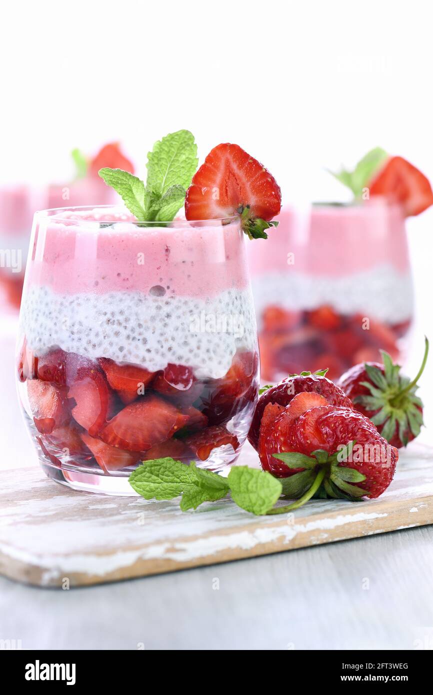 Strawberry dessert with milk vanilla chia and fresh strawberry pieces