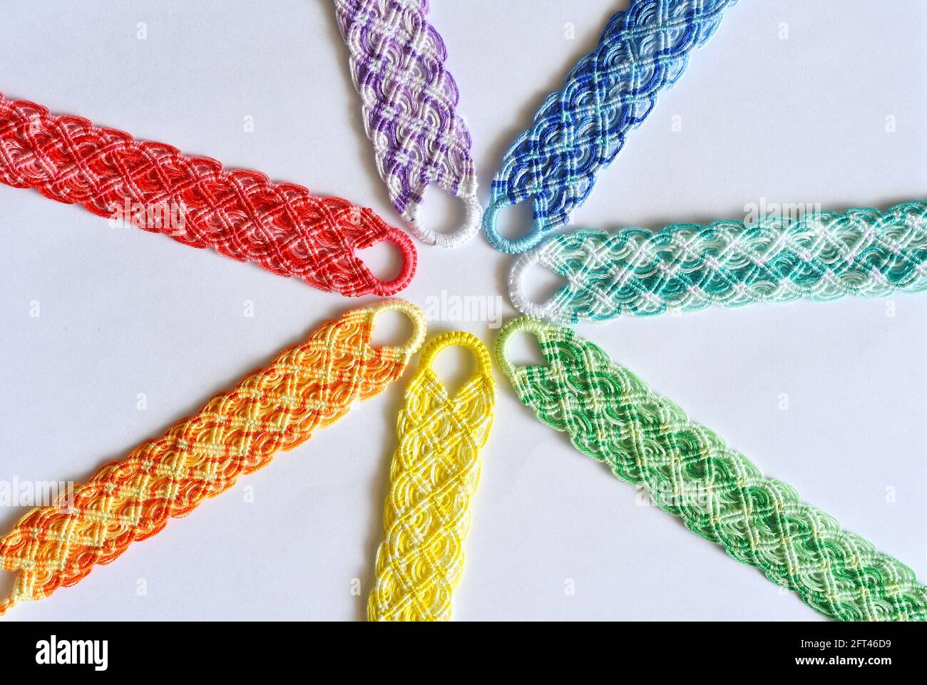 DIY woven friendship bracelets with special braiding. Rainbow colors.  Summer accessories Stock Photo - Alamy