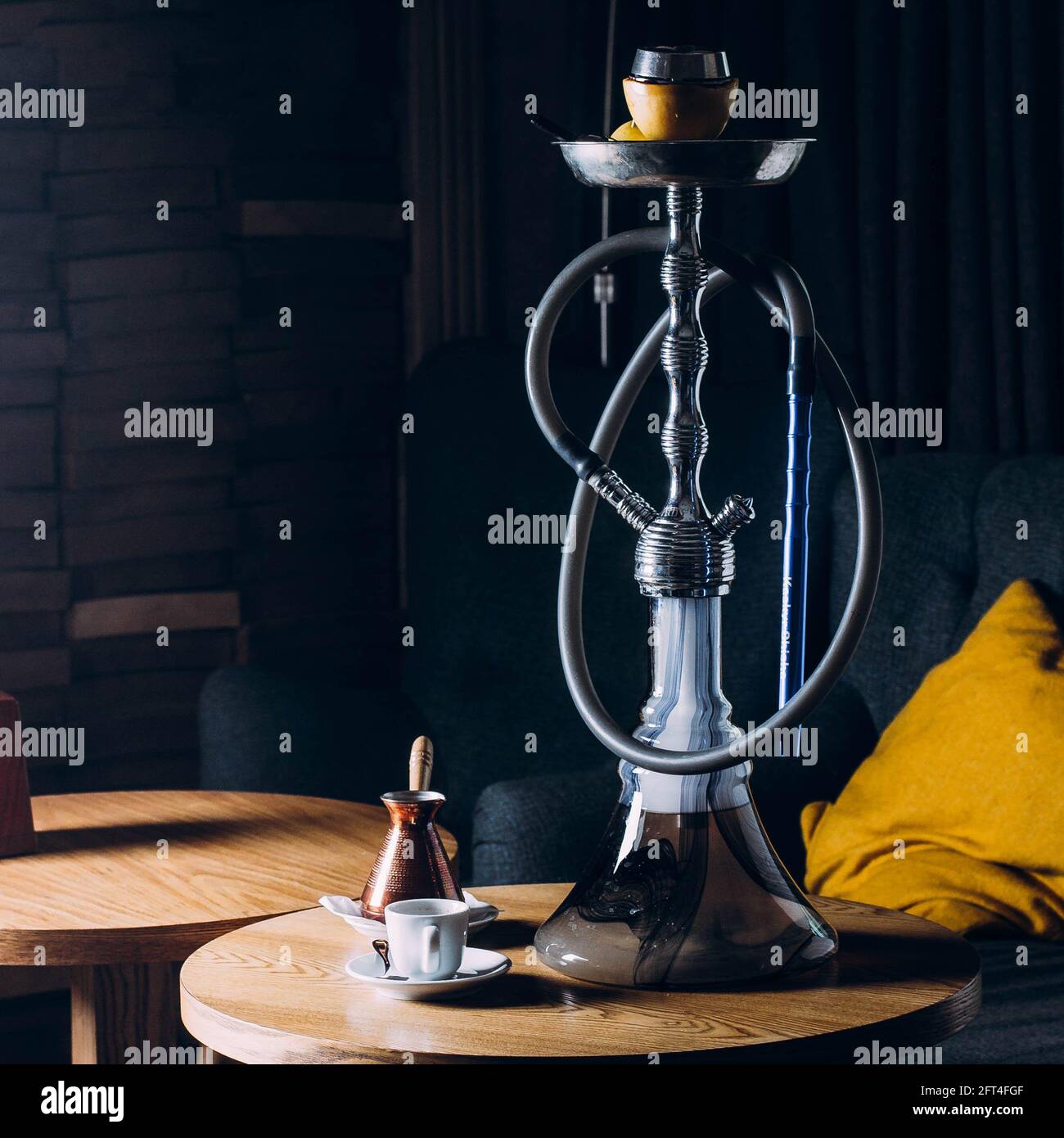 Hookah on shisha bowl with dark background. Stylish oriental shisha in