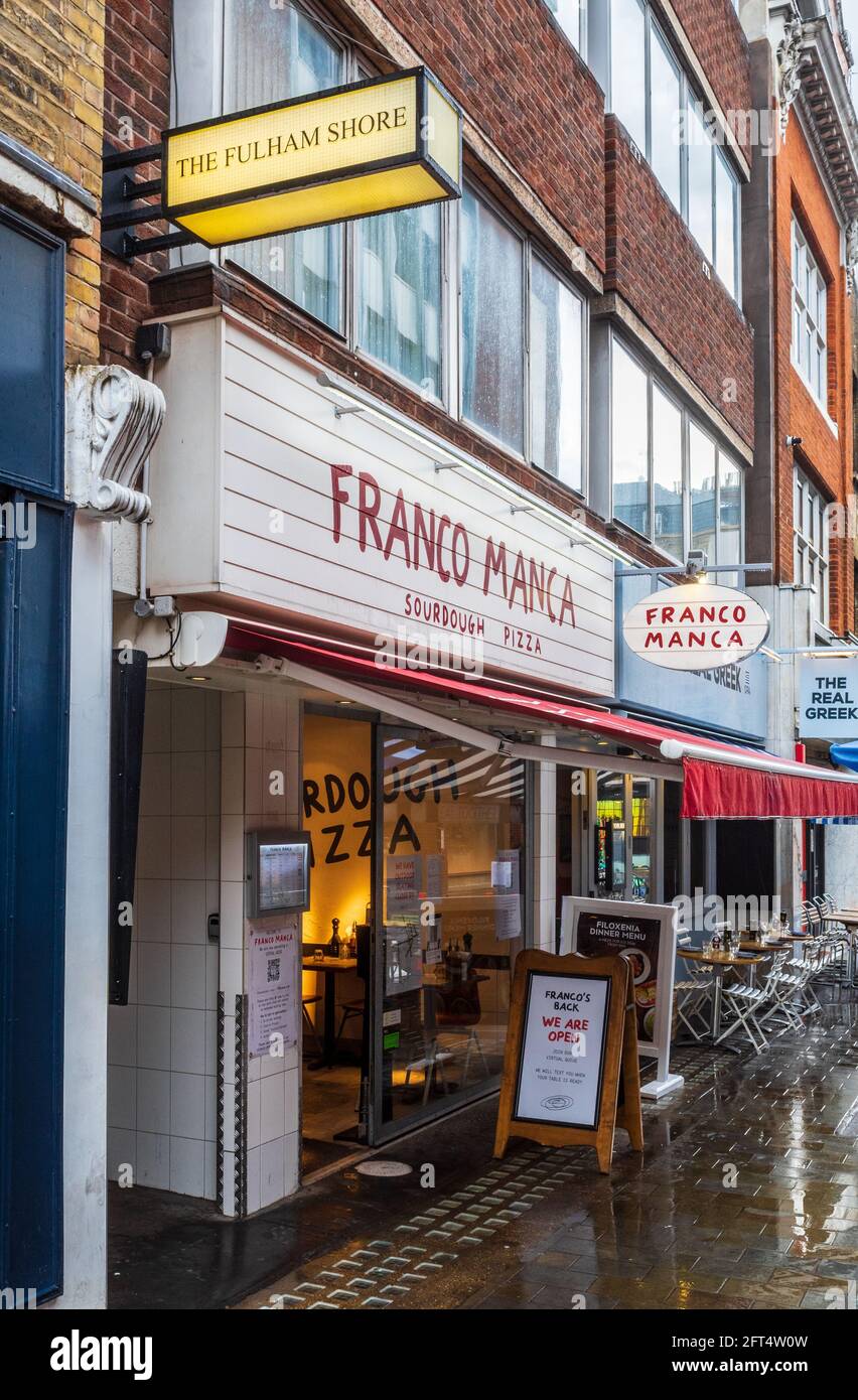 The Fulham Shore Plc on Berwick Street, Soho, London. The Fulham Shore is a restaurant company owning Franco Manca & The Real Greek restaurant chains. Stock Photo
