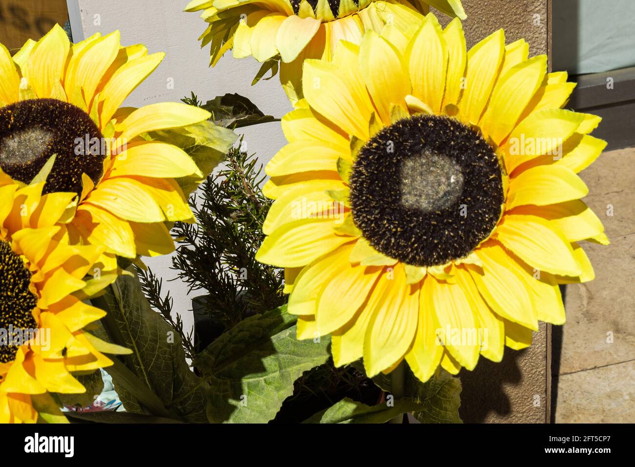 Center of artificial yellow sunflowers as decoration for any