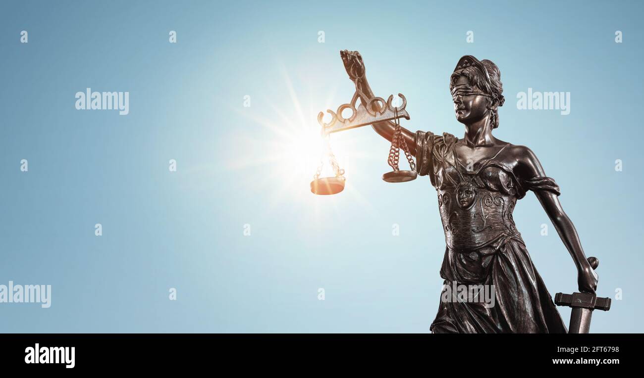 Lady justice, Themis sculpture over clear blue sky with copy space Stock Photo