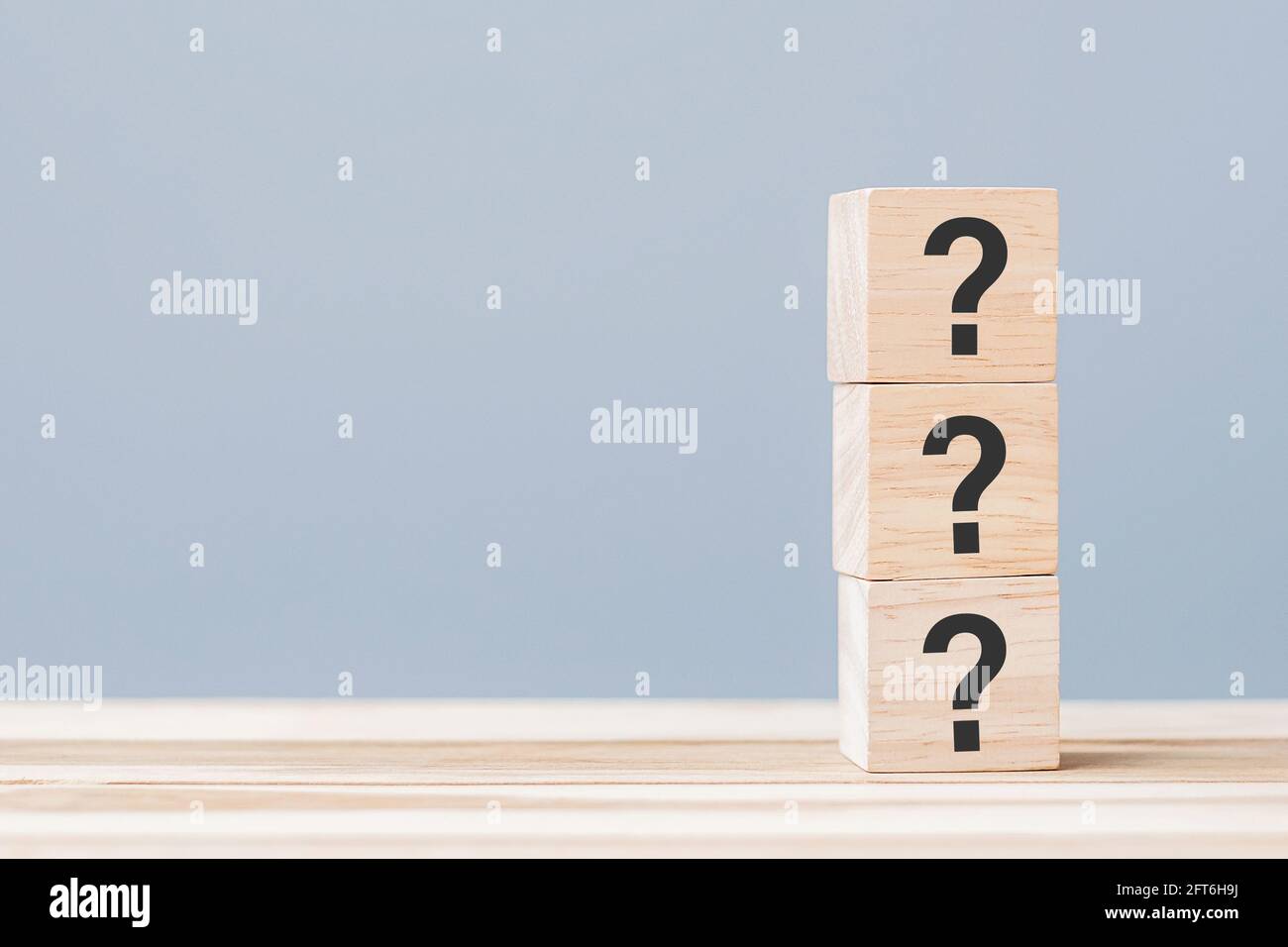 Questions Mark ( ? ) on wooden cube block on table background. FAQ ...