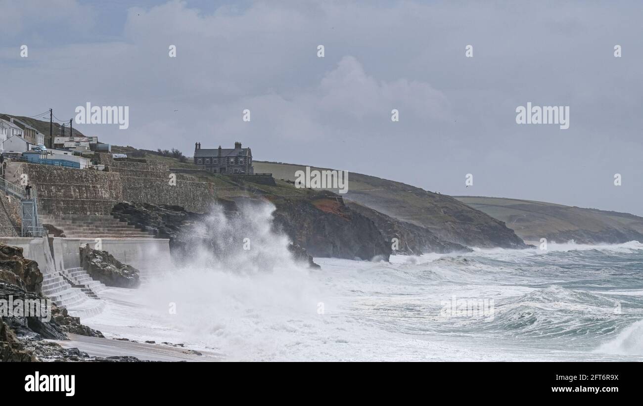 Porthleven, Cornwall, UK. 21st May 2021. UK Weather. Gale force winds battered the coast of Cornwall at Porthleven today, with large areas of the harbour swamped with sea foam. Credit SImon Maycock / Alamy Live News. Stock Photo