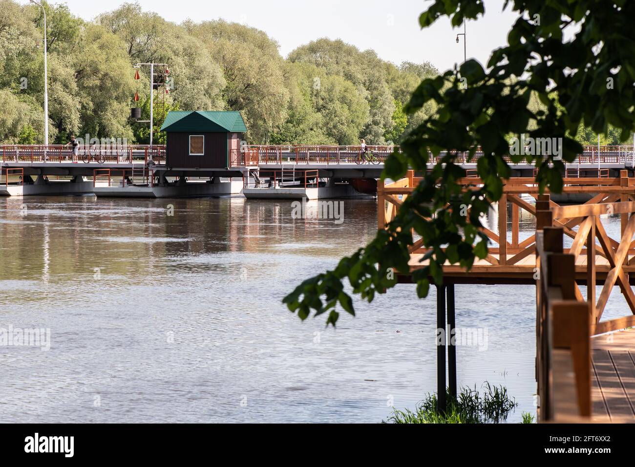 KOLOMNA, RUSSIA - MAY, 30, 2020: Wooden embankment and Pontoon Bridge Bobrenevsky at Moscow River in Kolomna, Russia Stock Photo