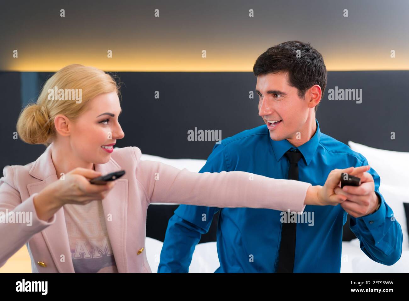 Woman hotel bed remote control hi-res stock photography and images - Alamy