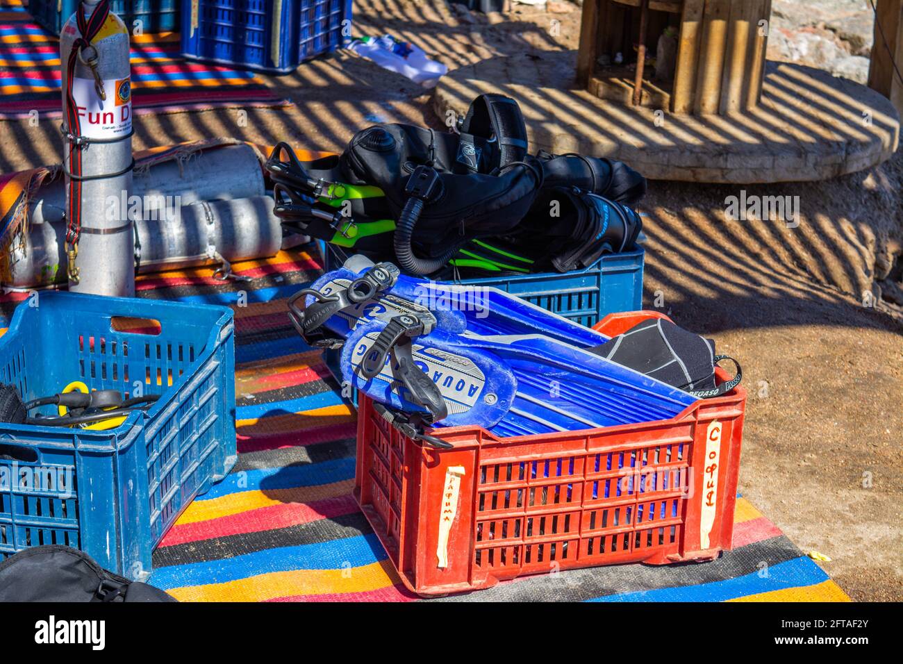 Diving equipment on the beach. flippers, masks, tubes, diving cylinders
