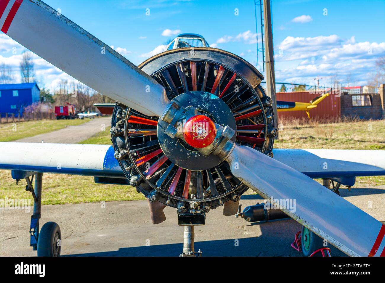Open engine of a light single-engine pleasure private plane. Aircraft repair on a sunny spring day. small aircraft engine maintenance. Stock Photo