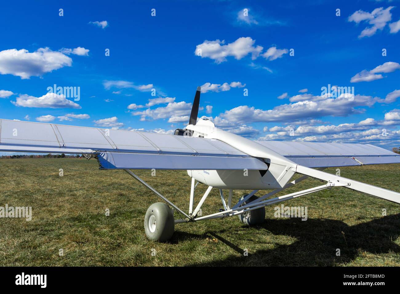 A radio-controlled unmanned aircraft stands on the runway of an airfield. Drone for agricultural purposes. Stock Photo