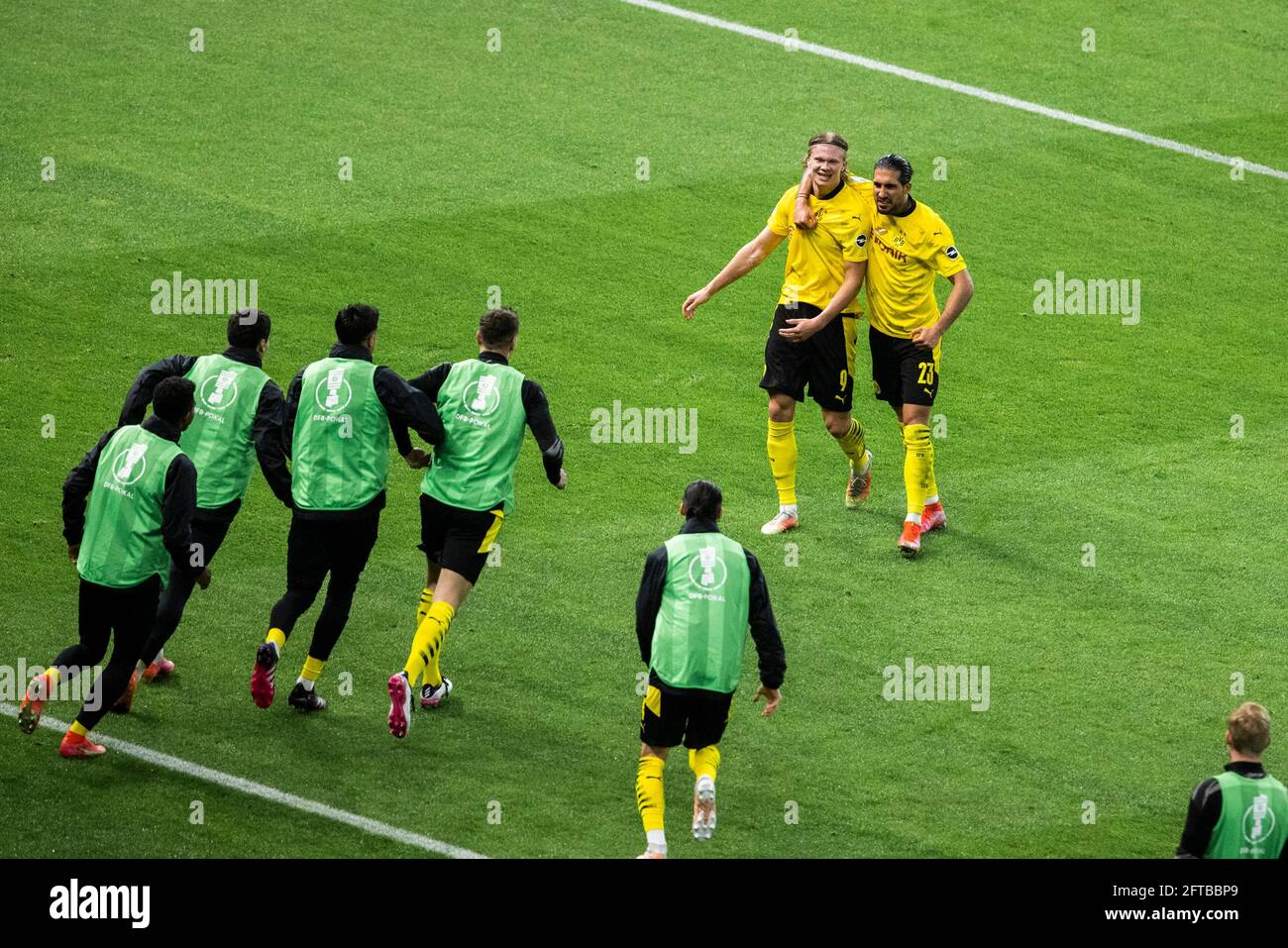 Berlin, Olympiastadion 13.05.21: Erling Haaland (BVB) (L) celebrates scoring the 4:1 goal with Emre Can (BVB) and teammates during the final cup match Stock Photo