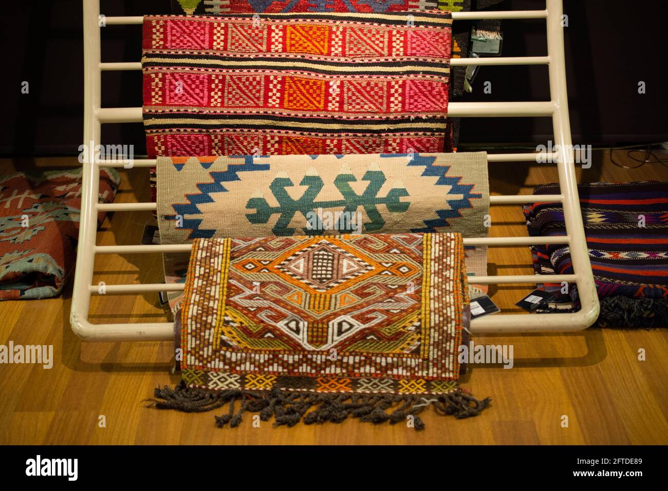 Traditional Turkish rug textile with patterns in bazaar Stock Photo Alamy