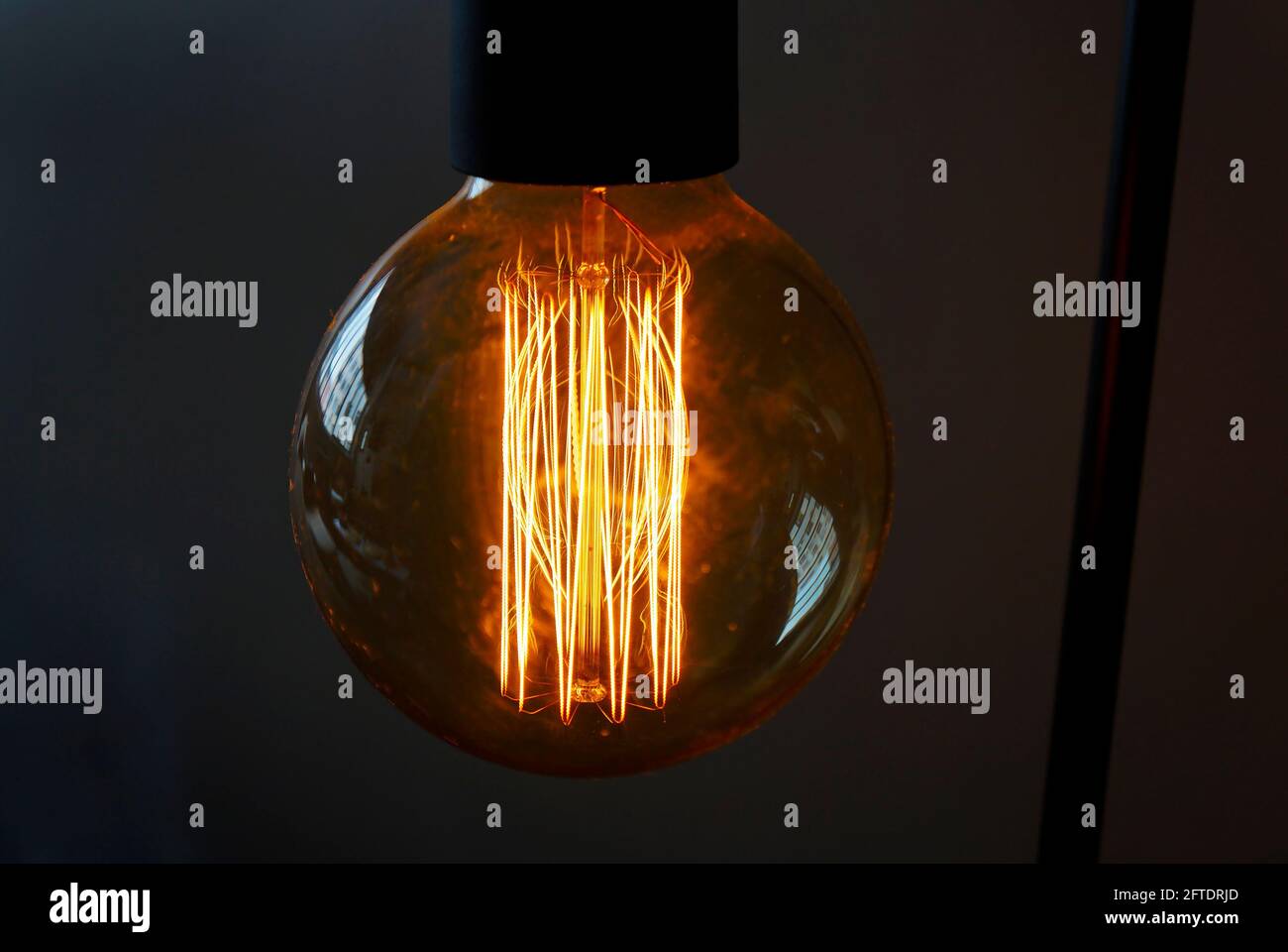 Closeup of a glowing incandescent light bulb filaments Stock Photo Alamy