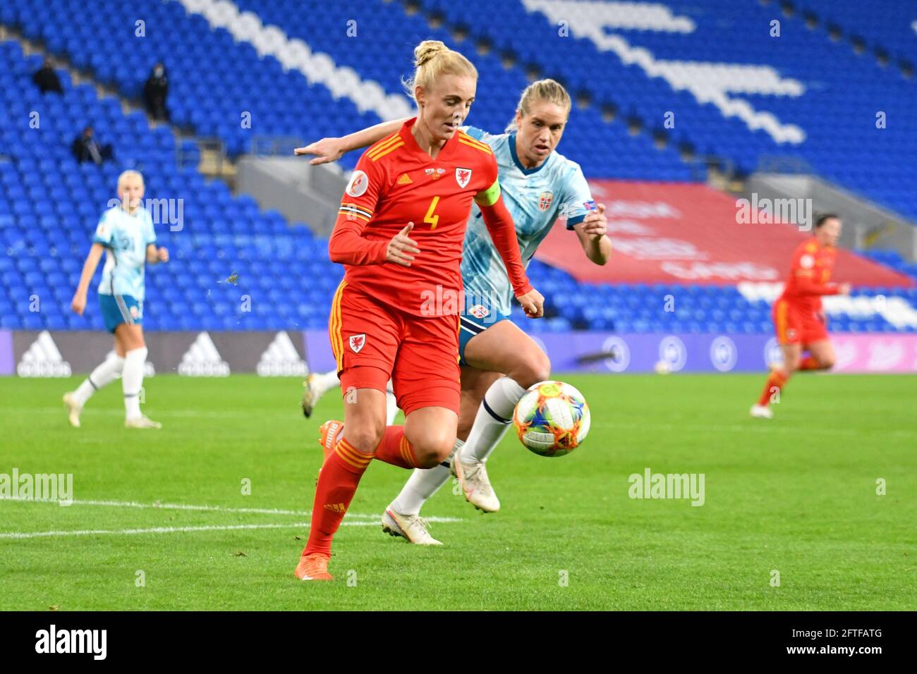 Cardiff, Wales. 27 October, 2020. Sophie Ingle of Wales Women under pressure from Elise Thorsnes of Norway Women during the UEFA Women's European Championship 2020 Qualifying Group C match between Wales Women and Norway Women at the Cardiff City Stadium in Cardiff, Wales, UK on 27, October 2020. Credit: Duncan Thomas/Majestic Media. Stock Photo