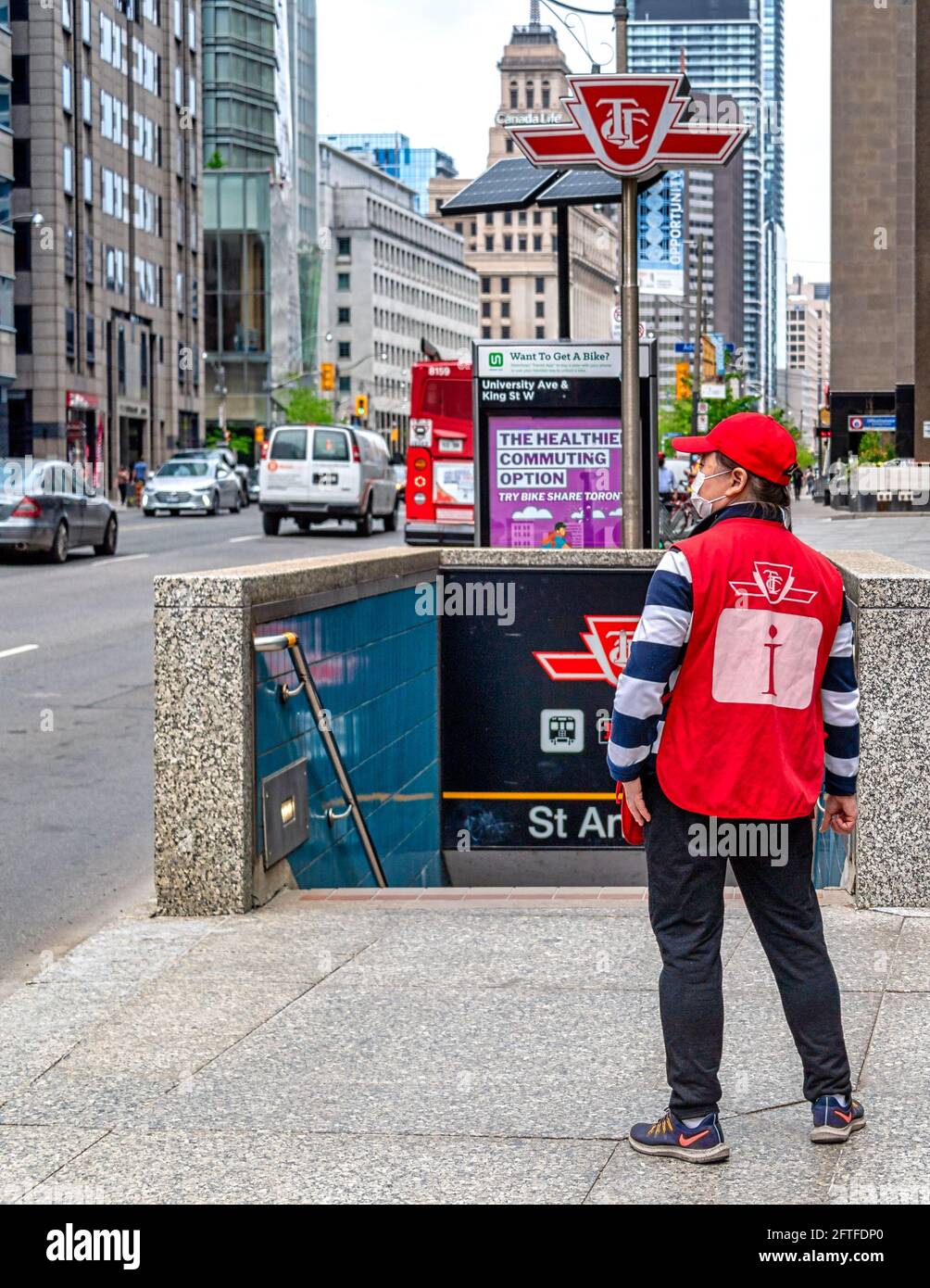 Customer service agent outside of the Saint Andrew Subway Station (Line 2). These agents offer information to commuters. They have been relocated to t Stock Photo