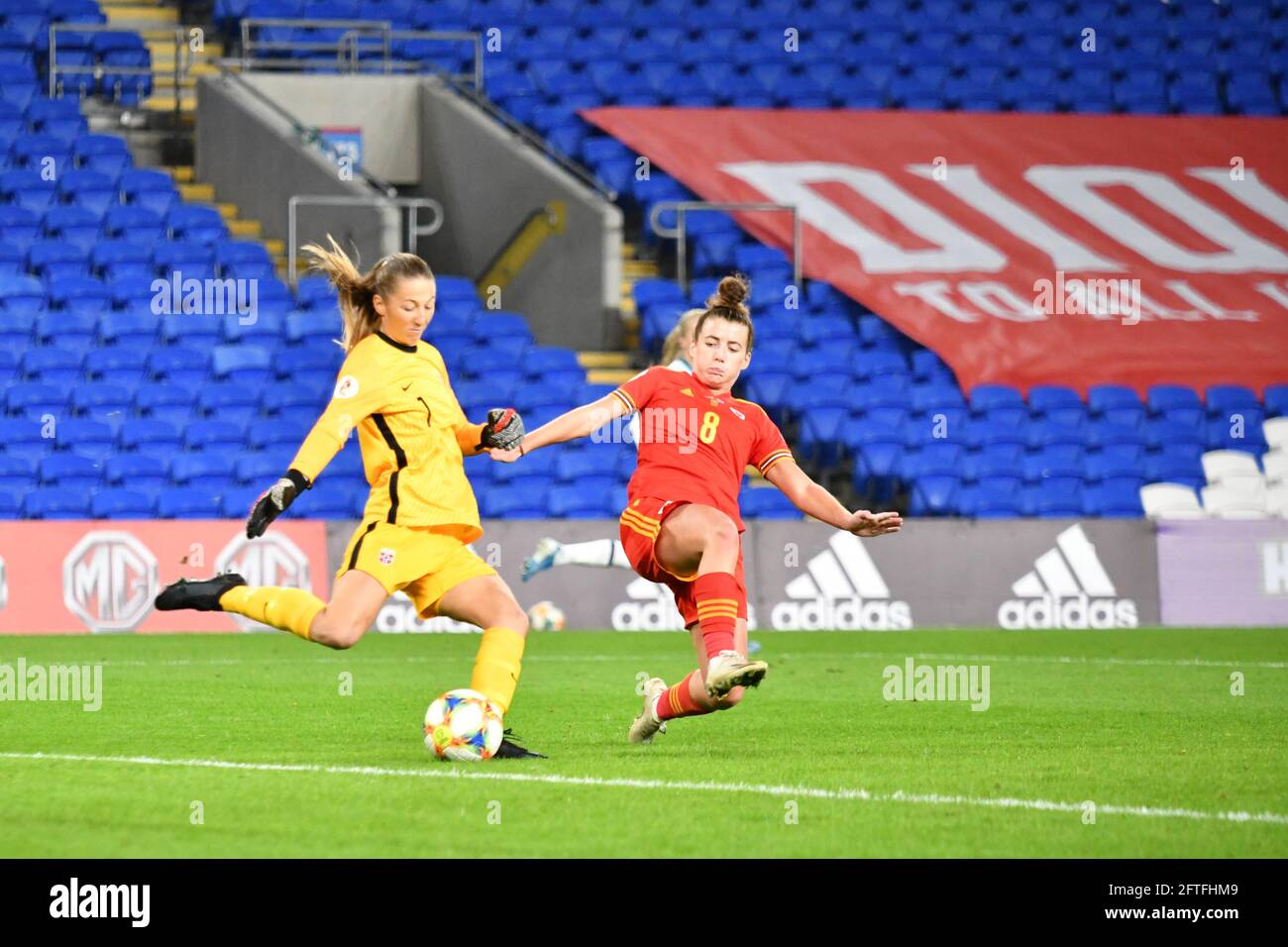 Cardiff, Wales. 27 October, 2020. Goalkeeper Cecilie Fiskerstrand of Norway Women under pressure from Angharad James of Wales Women during the UEFA Women's European Championship 2020 Qualifying Group C match between Wales Women and Norway Women at the Cardiff City Stadium in Cardiff, Wales, UK on 27, October 2020. Credit: Duncan Thomas/Majestic Media. Stock Photo