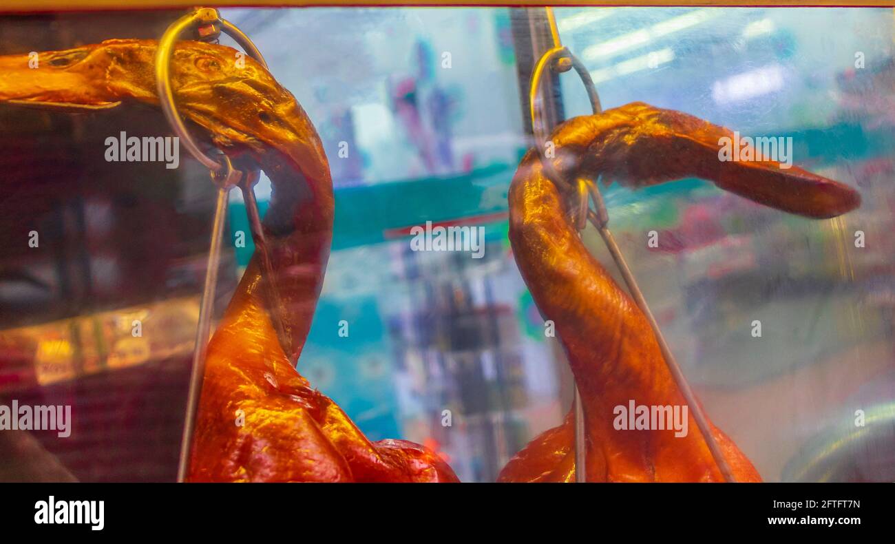 Disgusting unfamiliar Thai food ducks chicken behind window street food ...