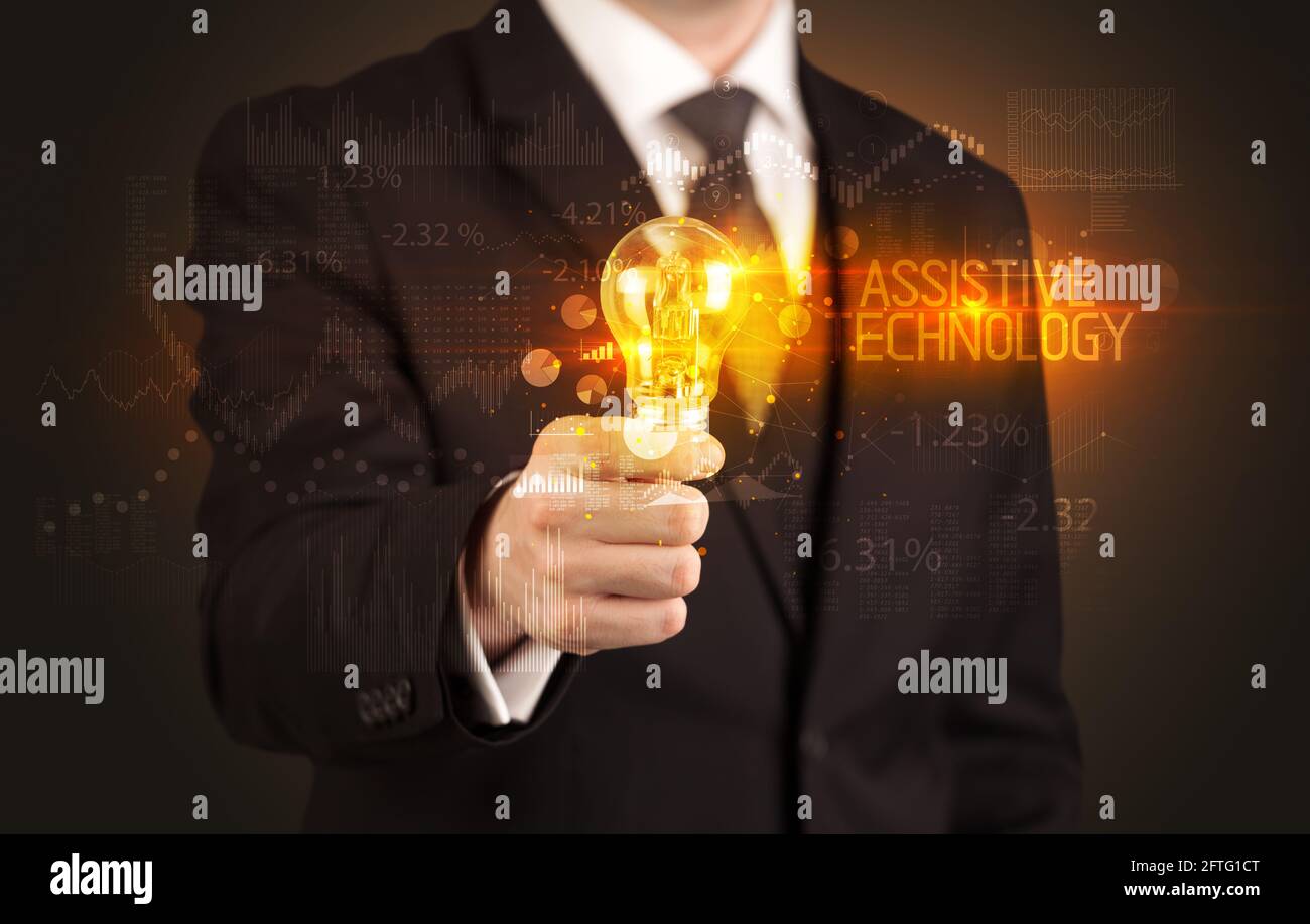 Businessman holding a lightbulb concept Stock Photo - Alamy