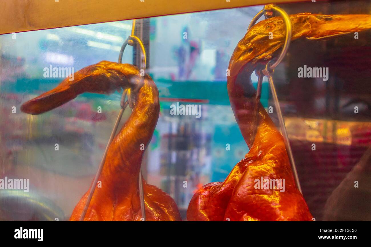 Disgusting unfamiliar Thai food ducks chicken behind window street food ...