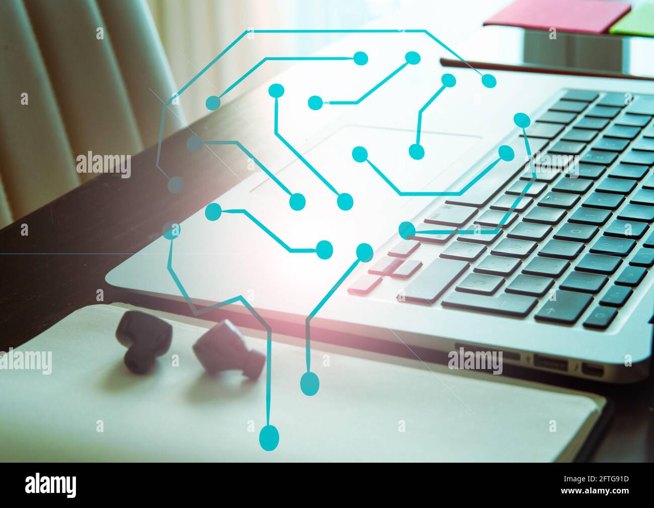 Brain over laptop. Intelligence and technology use concept Stock Photo