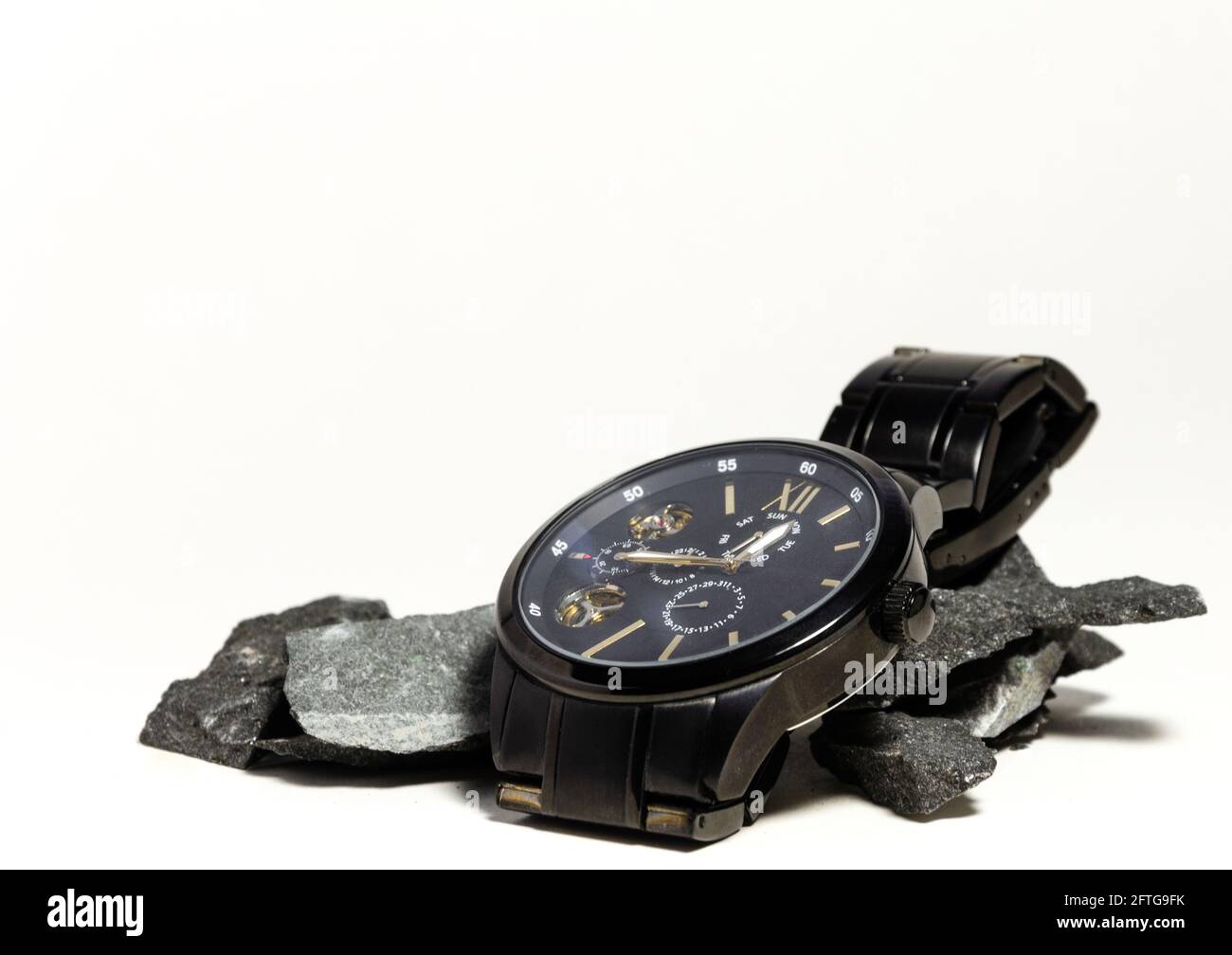 Luxury watch on rocks hi-res stock photography and images - Alamy
