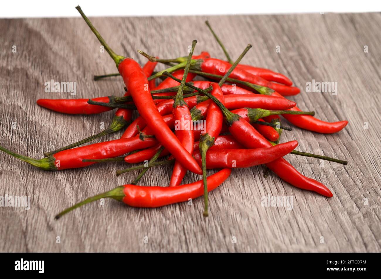 Red Hot Chili Peppers on the old wooden background Stock Photo - Alamy