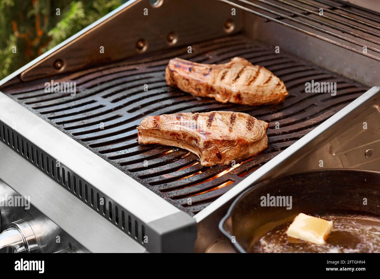 Maple Brined Pork Chops on Grill Stock Photo