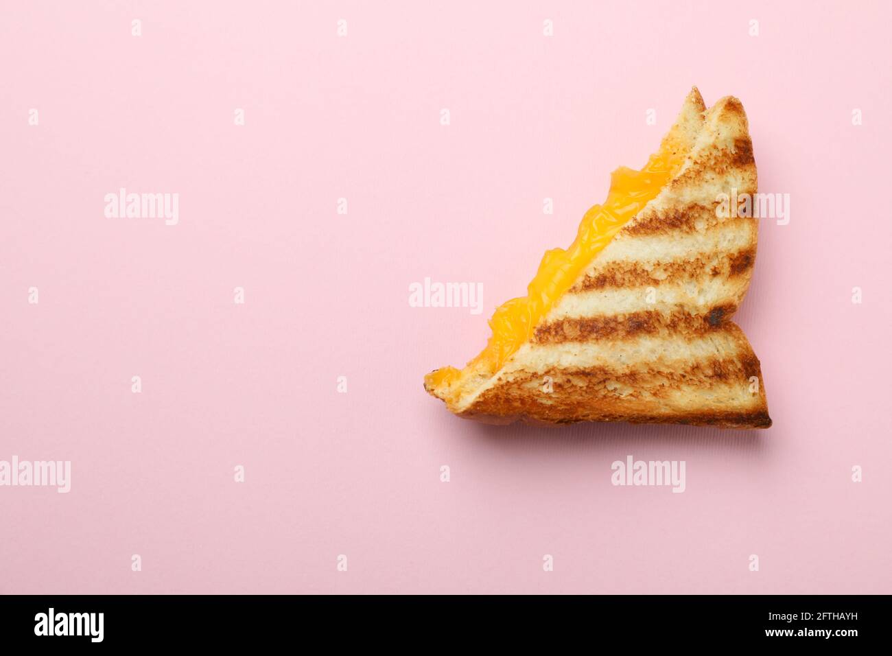 Tasty grilled sandwich with cheese on pink background Stock Photo - Alamy