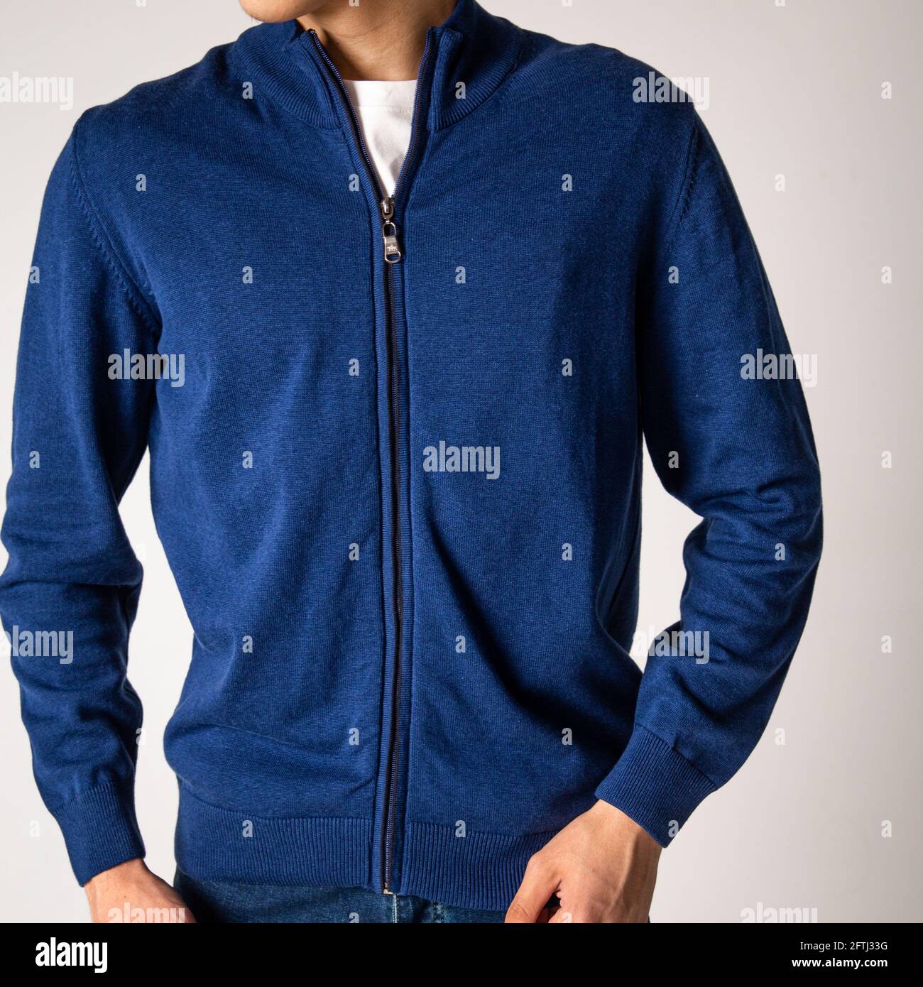 guy in a blue jacket with a lock on a white background. Stock Photo