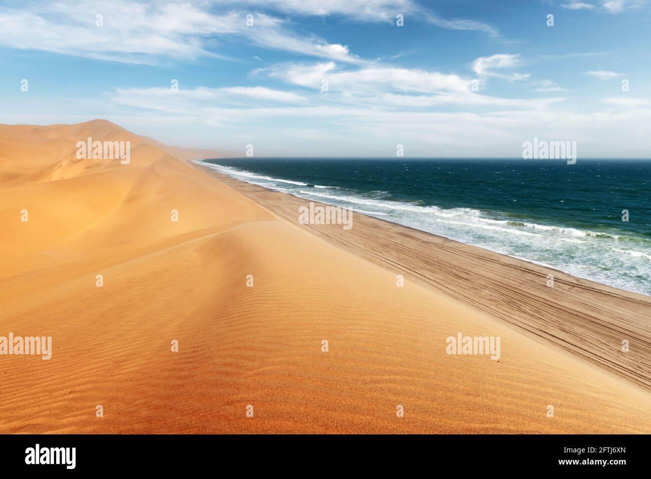 Namib desert and Atlantic ocean waves Stock Photo