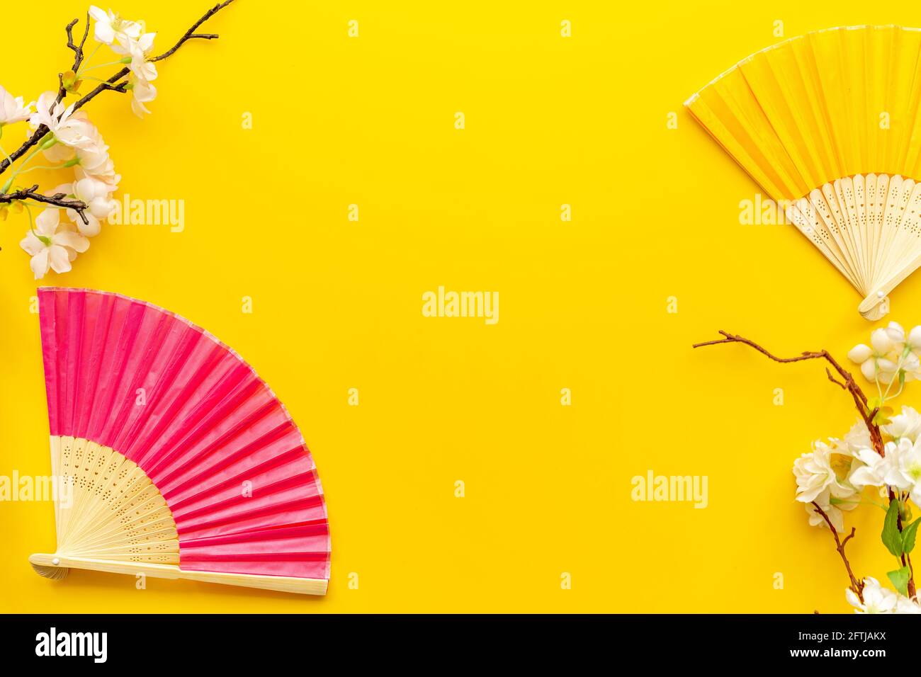 Asian background with hand fans and blossom branches Stock Photo - Alamy
