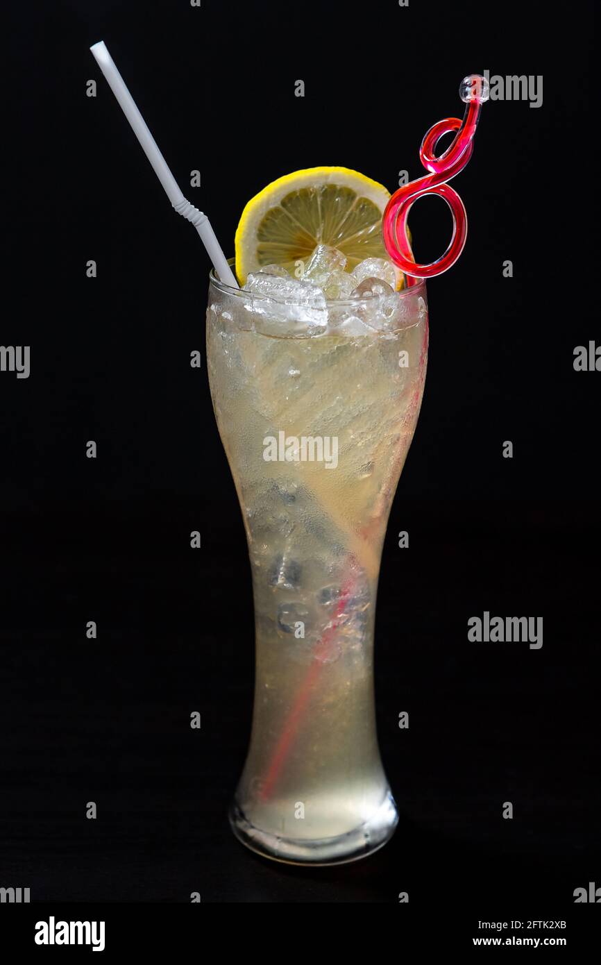 A glass of iced cocktail on black background Stock Photo