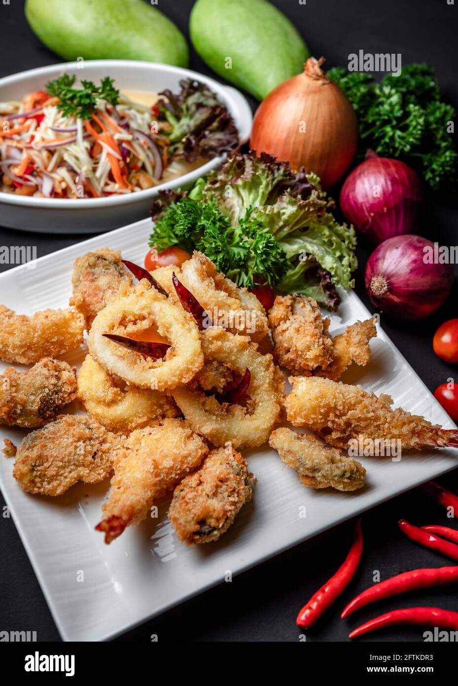 A Dish of Deep Fried Battered Seafood Tempura Sided with Thai Spicy