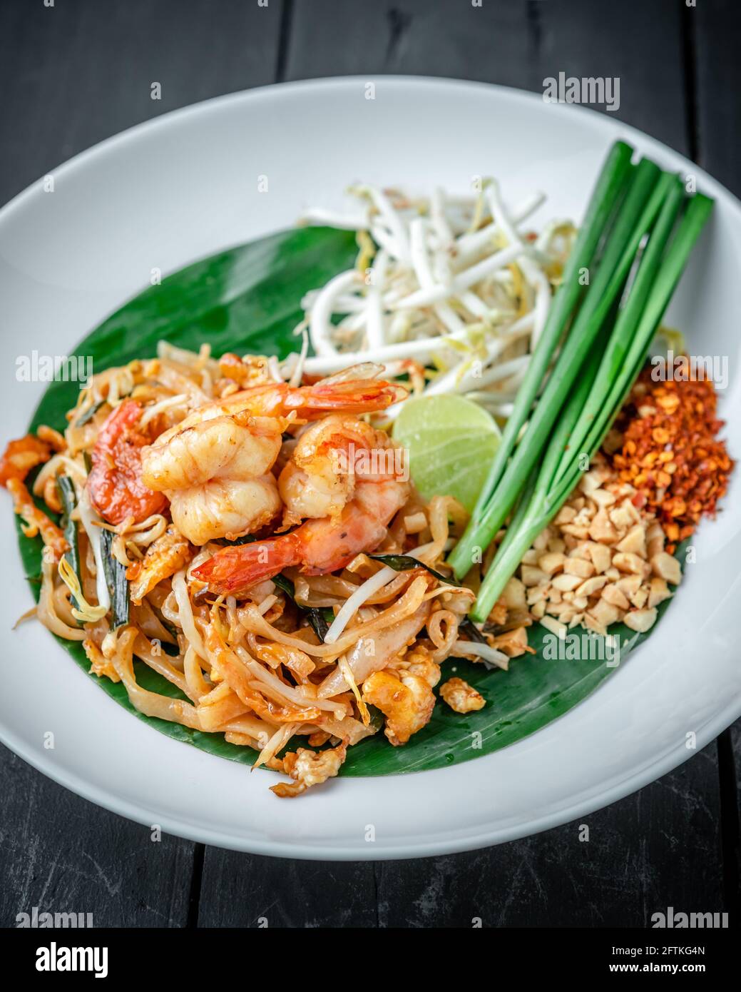 A Dish of Shrimp Pad Thai noodle sided with Fresh Beansprouts and