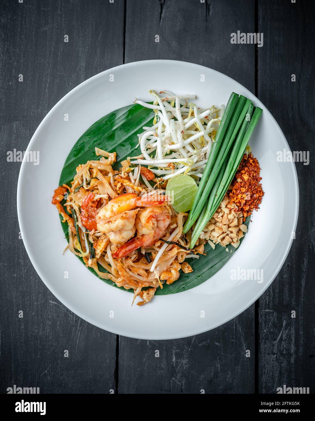 A Dish of Shrimp Pad Thai noodle sided with Fresh Beansprouts and