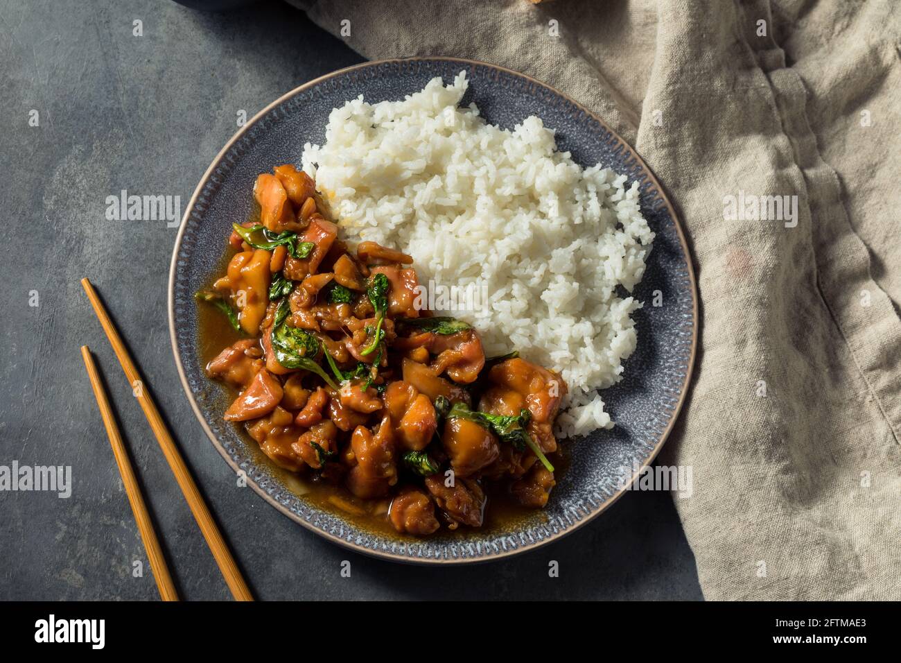 Homemade Taiwanese Three Cup Chicken with Rice and Basil Stock Photo