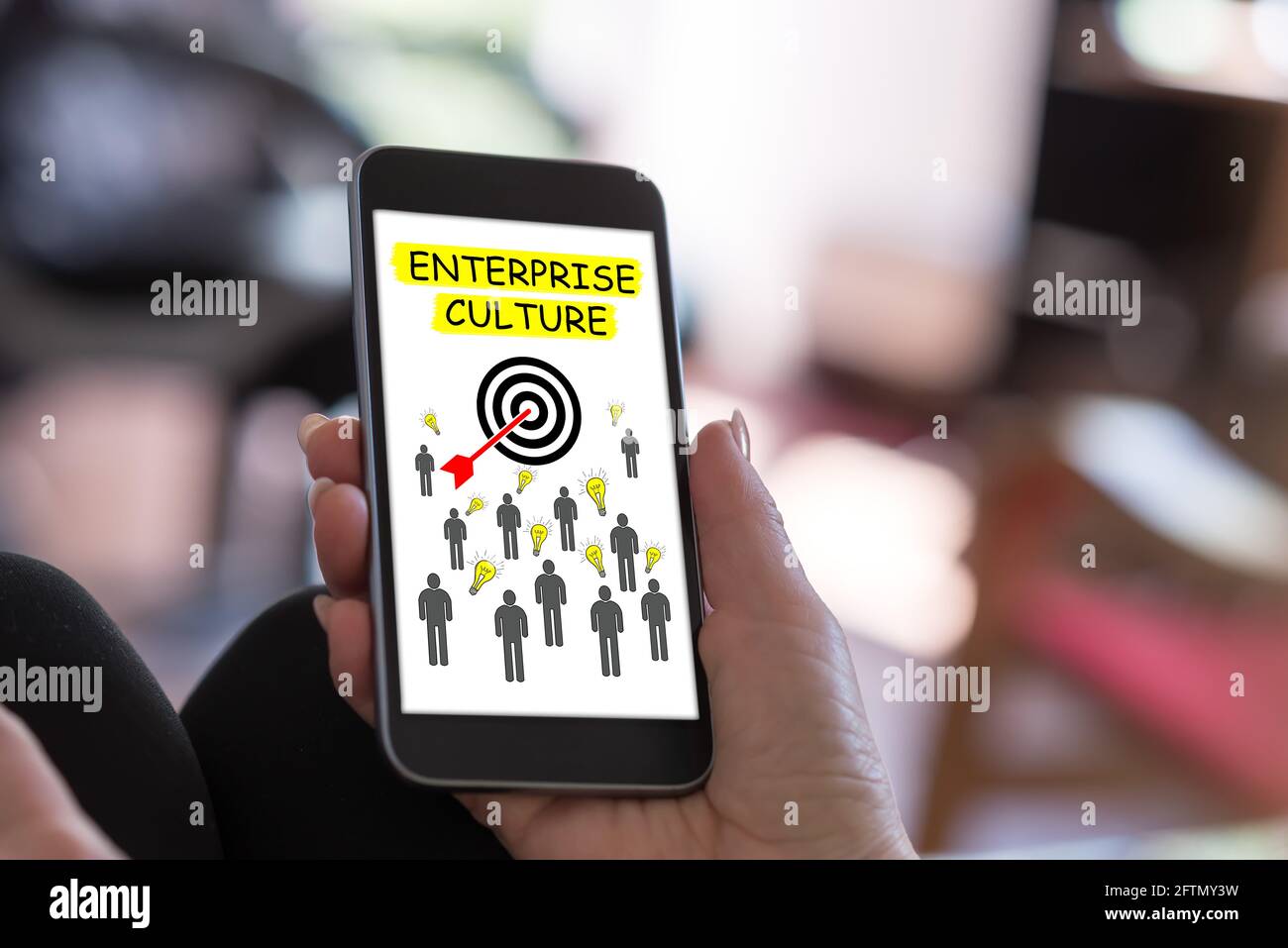 Hand Holding A Smartphone With Enterprise Culture Concept Stock Photo Alamy