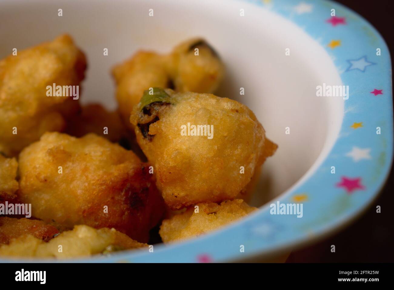 Close up of Golden Brown Crispy white lentils Fritters Photography Stock Photo