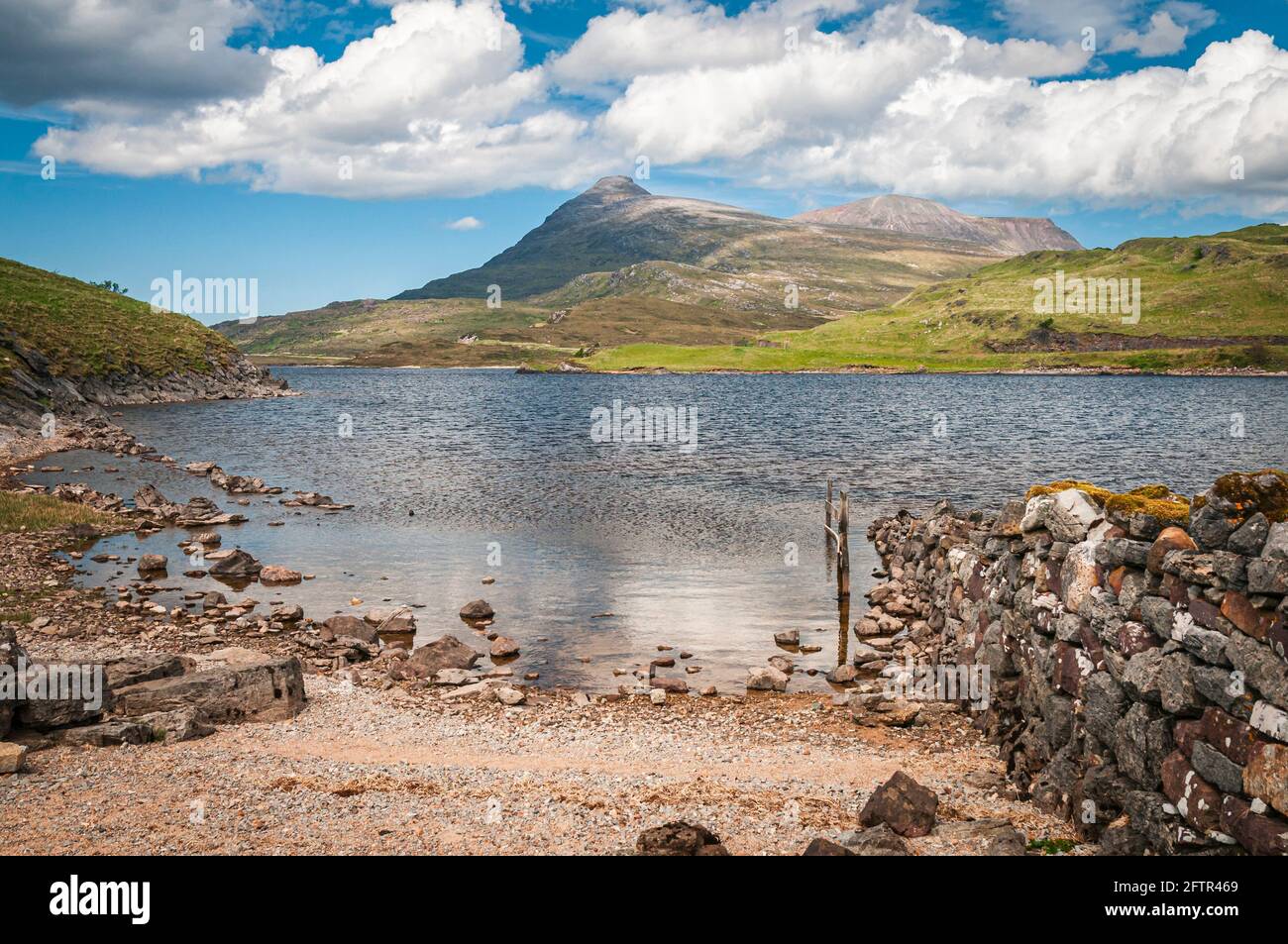 A sunny, summer, 3 shot HDR image of the distant mass that is Quinag, from Loch Assynt in Sutherland, Scotland. 27 May 2014 Stock Photo