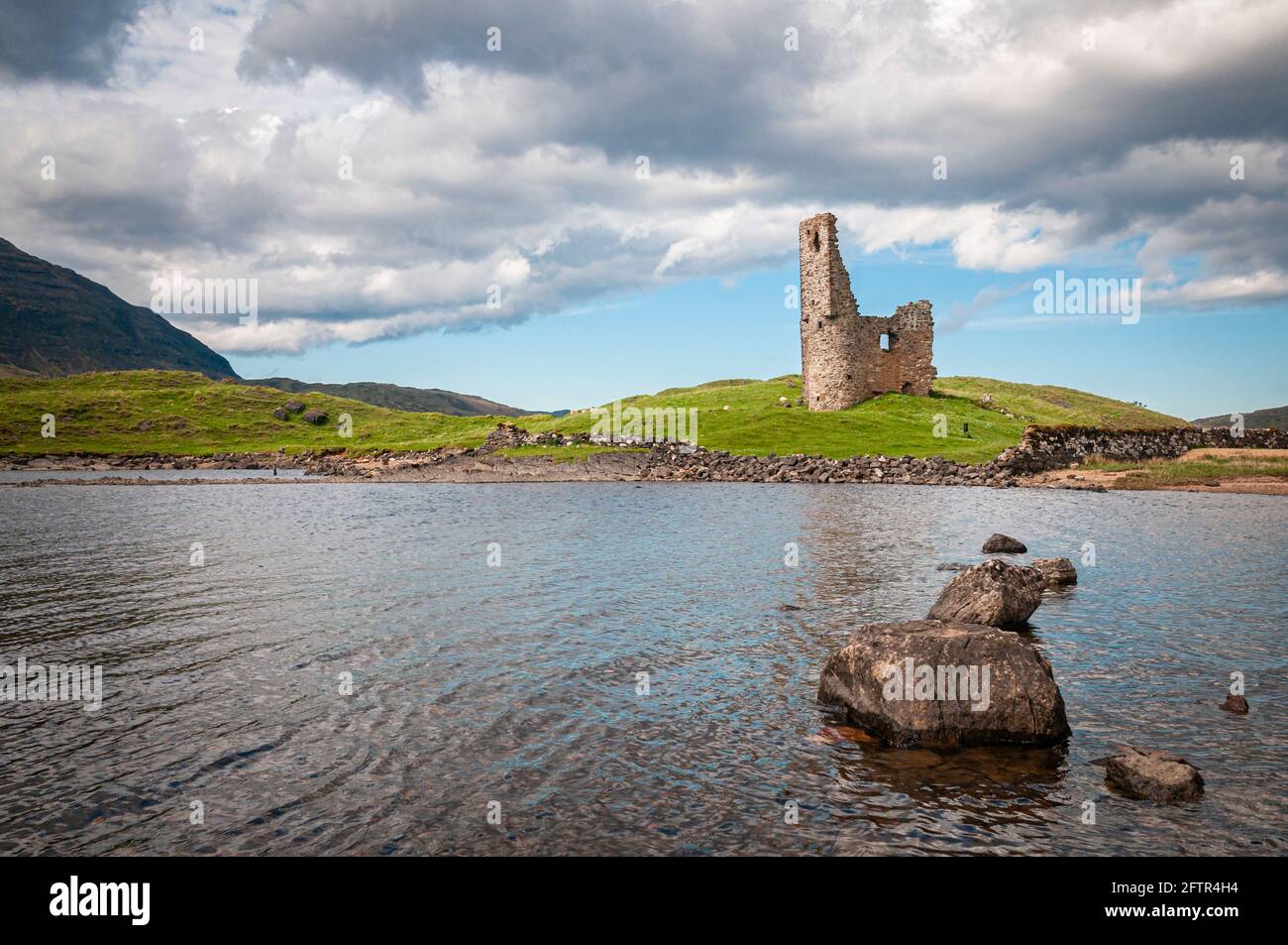 A summer 3 shot HDR image of Ardvreck Castle on the shores of Loch Assynt, Sutherland in the Highlands of Scotland. 27 May 2014 Stock Photo